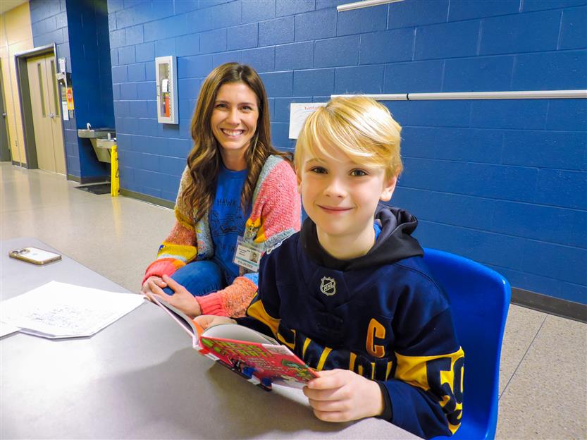 Students read to volunteers